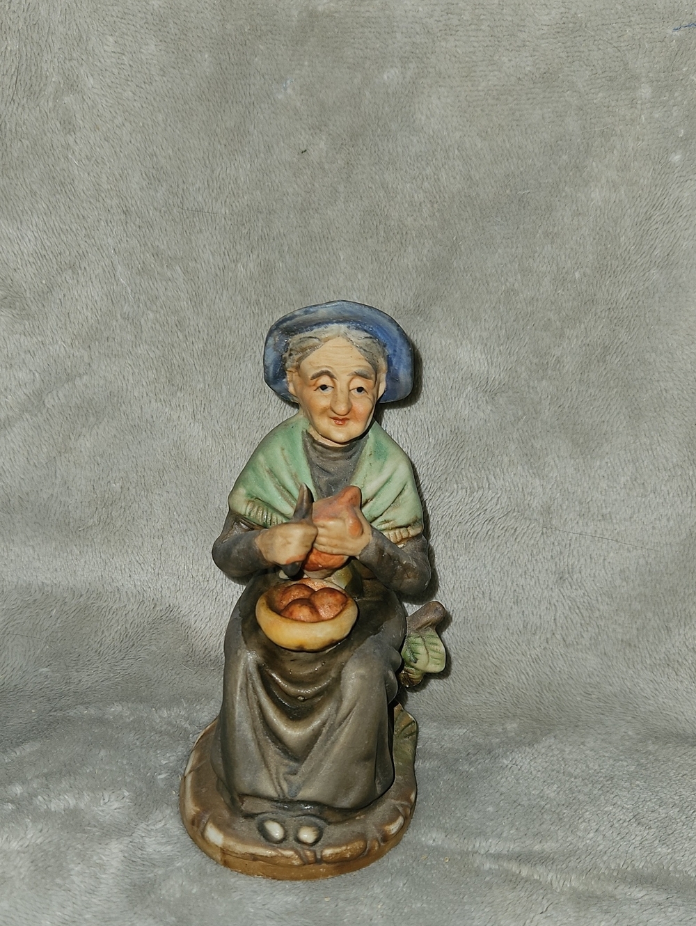 Hand-Painted Ceramic Figurine — Seated Elderly Woman in Blue and Green